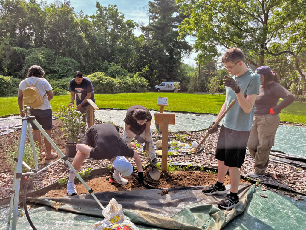 sangha participants working at the meadow farm